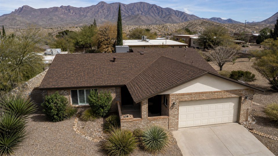 Completed gray architectural shingle roofing project from above